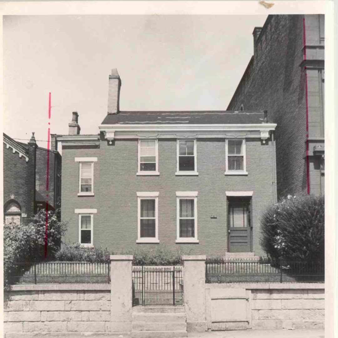 vintage exterior view of a historical brick home